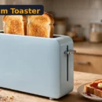 BELLA Fits-Anywhere Slim Toaster Review: The Best Slim Toaster for Tiny Kitchens? (2026) BELLA slim toaster review - slim light-blue toaster with toast on a small kitchen counter