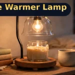 Candle Warmer Lamp Review: 50W Dimmable Timer Lamp for $28.89 — Worth It? (Honest) Candle warmer lamp review: 50W dimmable timer candle warmer lamp glowing on a bedside table