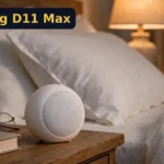 Dreamegg D11 Max Review: The $29 White Noise Machine Everyone Buys (2026) Dreamegg D11 Max review - white noise machine on a bedside table
