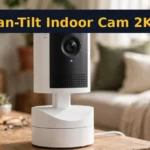 Ring Pan-Tilt Indoor Cam 2K on a living room table watching the room